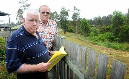 Sam Benstead and Rod Tracey look over the back fence to what will be a major 142 multi-residential development. Sam Benstead and Rod Tracey look over the back fence to what will be a major 142 multi-residential development.